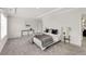 This main bedroom has carpeted floors, a ceiling tray, a bed, and a door into the main bath at 2316 Echelon Ln, Smyrna, GA 30080