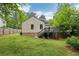 The backyard features lush grass, a well-kept lawn, and a charming exterior with a functional deck at 2864 White Oak Dr, Decatur, GA 30032