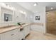 Bright bathroom with double vanity, soaking tub, and glass-enclosed shower, offering a spa-like retreat at 2864 White Oak Dr, Decatur, GA 30032