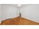 Bright bedroom showcasing hardwood floors and ample closet space, ideal for a comfortable and organized living at 2864 White Oak Dr, Decatur, GA 30032