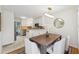 Dining area with wood table and chairs, adjacent to a modern white kitchen at 2864 White Oak Dr, Decatur, GA 30032