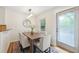Cozy dining room featuring a wooden table, six chairs and modern light fixture at 2864 White Oak Dr, Decatur, GA 30032