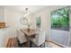 Bright dining room featuring a modern light fixture and views to the outdoor deck at 2864 White Oak Dr, Decatur, GA 30032