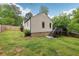 The backyard features lush grass, a well-kept lawn, and a charming exterior with a functional deck at 2864 White Oak Dr, Decatur, GA 30032