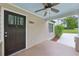 Inviting front porch with ceiling fan and craftsman-style front door at 2864 White Oak Dr, Decatur, GA 30032