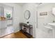 Hallway with hardwood floors and access to kitchen and bathroom at 2864 White Oak Dr, Decatur, GA 30032