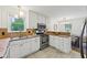 Efficient kitchen with white cabinets, stainless appliances, and stone countertops at 2864 White Oak Dr, Decatur, GA 30032