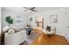 Open-concept living room with hardwood floors, and view into the kitchen at 2864 White Oak Dr, Decatur, GA 30032