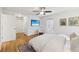 Bright main bedroom features a fan, television and access to bathroom at 2864 White Oak Dr, Decatur, GA 30032