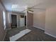 Damaged bedroom featuring neutral walls, carpeting, and a ceiling fan at 3789 Waldrop Ln, Decatur, GA 30034