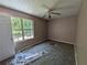 Bedroom with window view, ceiling fan, and wall to wall carpet at 3789 Waldrop Ln, Decatur, GA 30034
