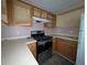 Dated kitchen with wood cabinets and stainless steel stove/oven at 3789 Waldrop Ln, Decatur, GA 30034
