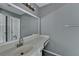 Bathroom features vanity with sink, marble countertop, mirror, and lighting at 5554 Clover Rise Ln, Norcross, GA 30093