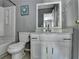 Bathroom with tub, toilet, sink, and vanity with white cabinets at 5554 Clover Rise Ln, Norcross, GA 30093