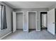 Bedroom features multiple closets, carpeted floor, and window at 5554 Clover Rise Ln, Norcross, GA 30093