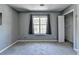 A bedroom showcases a window and a closet at 5554 Clover Rise Ln, Norcross, GA 30093