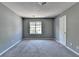 Bedroom with carpeted floor, window, and closet at 5554 Clover Rise Ln, Norcross, GA 30093