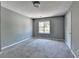 Bedroom with carpeted floor, window, and closet at 5554 Clover Rise Ln, Norcross, GA 30093