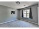 A bedroom showcases a window and wall decor at 5554 Clover Rise Ln, Norcross, GA 30093