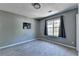 A bedroom showcases a window and wall decor at 5554 Clover Rise Ln, Norcross, GA 30093