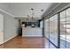 Dining space featuring hardwood floors and sliding glass doors leading to the backyard at 5554 Clover Rise Ln, Norcross, GA 30093