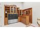 Home bar area with custom wood cabinetry and shelving, integrated with entertainment center at 1169 Dawn View Nw Ln, Atlanta, GA 30327