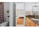 Bathroom with tile floors, a vanity with granite countertop, and shower with a patterned curtain at 1169 Dawn View Nw Ln, Atlanta, GA 30327