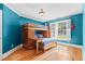 Cozy bedroom with hardwood floors, a bunk bed with desk, and a window with shutters at 1169 Dawn View Nw Ln, Atlanta, GA 30327