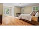Bright bedroom featuring hardwood floors, neutral walls, shuttered windows, and ample space at 1169 Dawn View Nw Ln, Atlanta, GA 30327