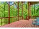 This relaxing porch features comfortable blue chairs, exposed support beams and views of the trees at 1169 Dawn View Nw Ln, Atlanta, GA 30327