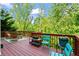 Enjoy outdoor living on this deck with comfortable seating and scenic views of the trees at 1169 Dawn View Nw Ln, Atlanta, GA 30327