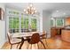 Bright eat-in kitchen features beautiful windows with view of deck and backyard at 1169 Dawn View Nw Ln, Atlanta, GA 30327