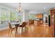 Eat-in kitchen with lots of sunlight and hardwood floors, with view into a dining room at 1169 Dawn View Nw Ln, Atlanta, GA 30327
