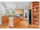 Charming eat-in kitchen features granite countertops, an island with cooktop and stainless steel appliances at 1169 Dawn View Nw Ln, Atlanta, GA 30327