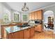 Bright kitchen boasts granite counters, stainless appliances, and an island with cooktop at 1169 Dawn View Nw Ln, Atlanta, GA 30327