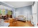 Inviting living room and dining area with hardwood floors, soft blue walls, and elegant décor at 1169 Dawn View Nw Ln, Atlanta, GA 30327