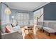Cozy living room with hardwood floors, comfortable seating, and bright, natural light at 1169 Dawn View Nw Ln, Atlanta, GA 30327