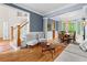 Comfortable living room and dining area featuring hardwood floors and sophisticated furnishings at 1169 Dawn View Nw Ln, Atlanta, GA 30327