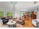 Spacious living room has natural light and hardwood floors and is adjacent to kitchen at 1169 Dawn View Nw Ln, Atlanta, GA 30327