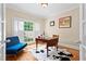 Cozy home office with a desk, comfortable seating, hardwood floors, and natural light at 1169 Dawn View Nw Ln, Atlanta, GA 30327