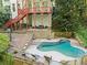 Beautiful backyard pool with waterfall feature and stone accents, perfect for outdoor relaxation and entertaining at 1169 Dawn View Nw Ln, Atlanta, GA 30327