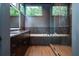 Modern bathroom featuring a soaking tub, a glass-enclosed shower, and dark wood cabinets at 246 Garland Ave, Decatur, GA 30030