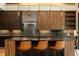 Modern kitchen featuring custom cabinets, an eat-in island, and sleek light fixtures at 246 Garland Ave, Decatur, GA 30030