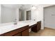 Bathroom with dual sinks, ample counter space, and large mirrors at 4150 Cedar Bridge Walk, Suwanee, GA 30024