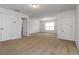 Spacious bedroom with neutral carpet, light walls, and natural light from the window at 4150 Cedar Bridge Walk, Suwanee, GA 30024