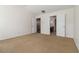 Bright bedroom featuring neutral carpet and easy access to the bathroom and the second floor at 4150 Cedar Bridge Walk, Suwanee, GA 30024