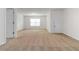 Large bedroom featuring neutral carpeting, a window for natural light, and a closet door at 4150 Cedar Bridge Walk, Suwanee, GA 30024