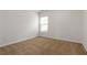 Comfortable bedroom with neutral carpet, light walls, and window at 4150 Cedar Bridge Walk, Suwanee, GA 30024