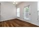 Bright dining area with hardwood floors and a door leading to the backyard at 4150 Cedar Bridge Walk, Suwanee, GA 30024