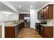 Beautiful kitchen featuring stainless steel appliances, granite countertops, and wood cabinets at 4150 Cedar Bridge Walk, Suwanee, GA 30024